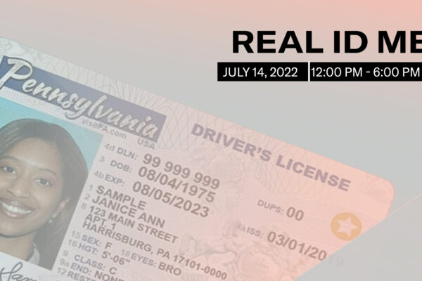 A sample Pennsylvania ID faded into the pink and blue trans pride flag colors. Above it reads, "Real ID Me. July 14, 2022. 12:00 pm to 6:00 pm."