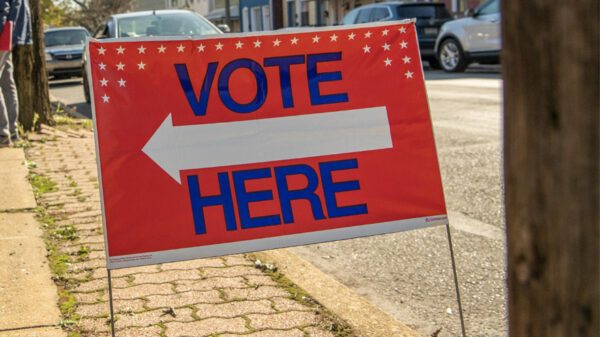 Vote Here sign along street