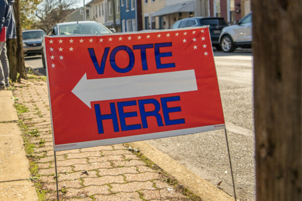 Vote Here sign along street