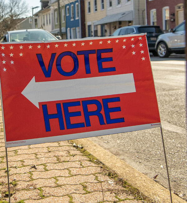 Vote Here sign along street