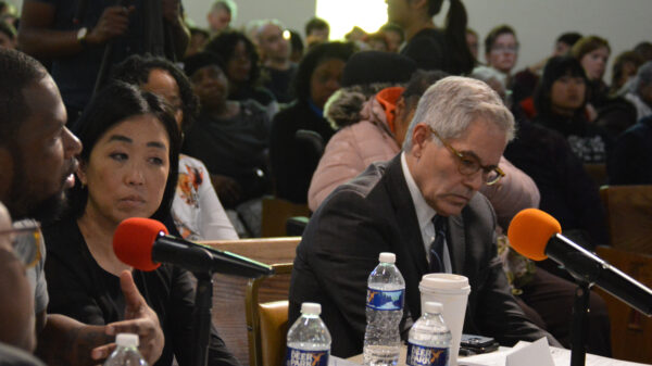 Helen Gym and Larry Krasner at a hearing
