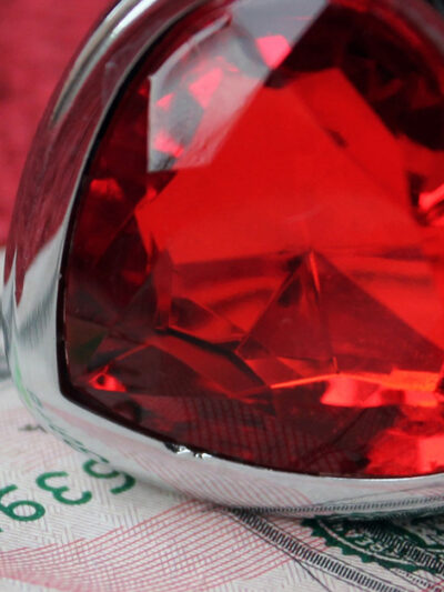 heart-shaped ring and fifty dollar bill