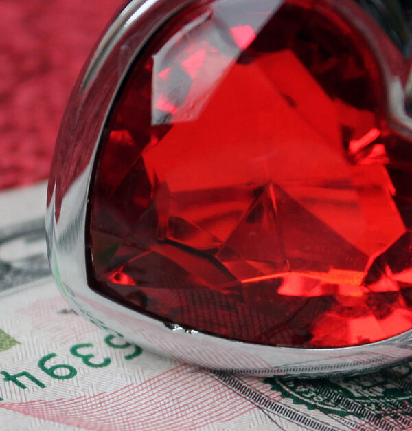 heart-shaped ring and fifty dollar bill