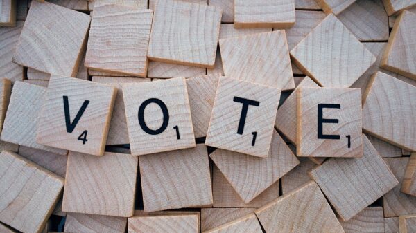 Scrabble tiles spelling out 'Vote'