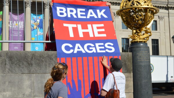 Banner reading "Break the cages"