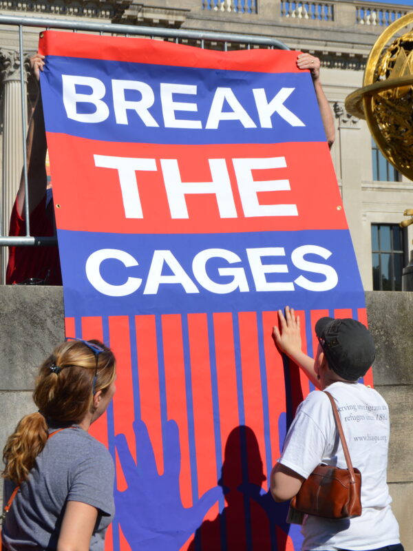 Banner reading "Break the cages"