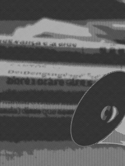 megaphone and stack of newspapers