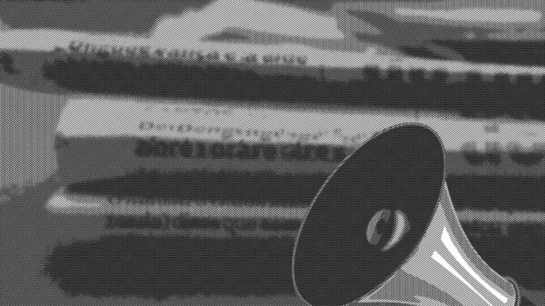 megaphone and stack of newspapers