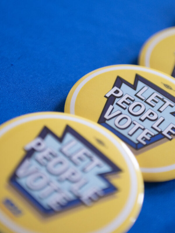 Stack of Let People Vote pins
