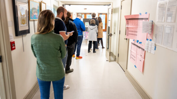 voters waiting in line at a polling station