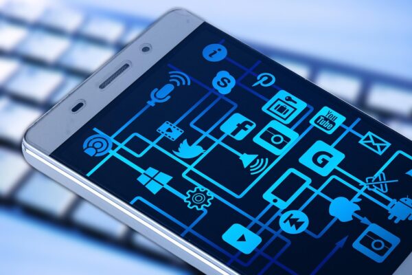 Cell phone image with a number of app icons visible on phone screen