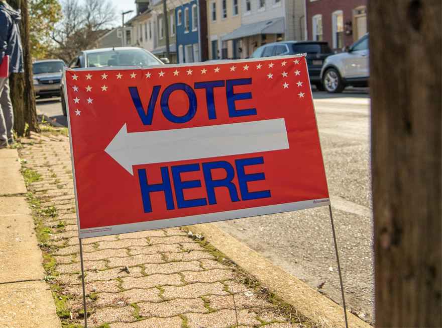 Vote Here sign along street