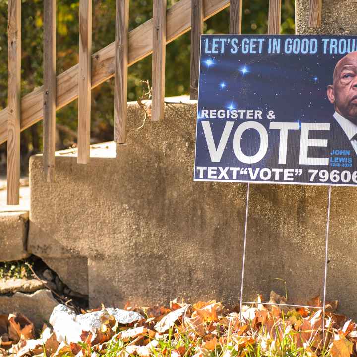 Yard sign showing Rep. John Lewis and encouraging people to vote
